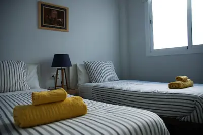 Cama o camas de una habitación en Encantador Ático con Terraza