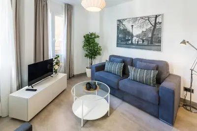Una televisión o centro de entretenimiento en Apartamentos Tendillas