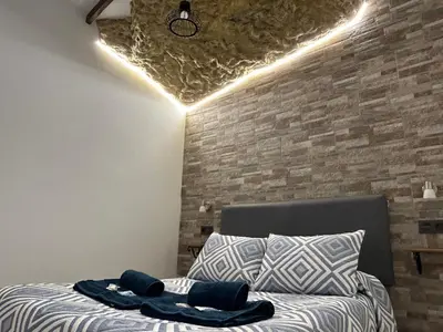 Cama o camas de una habitación en Casa entre Rocas Setenil