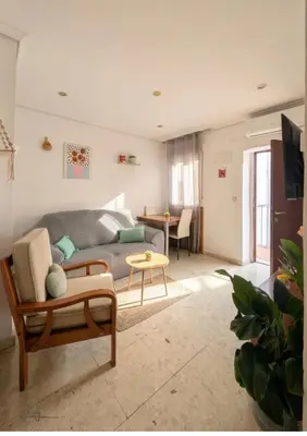 Zona de estar de Apartamento Polvora, junto al Puente Romano