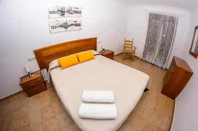 Cama o camas de una habitación en Apartamento Los Arcos