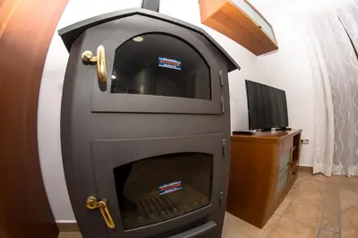 Una televisión o centro de entretenimiento en Apartamento Los Arcos