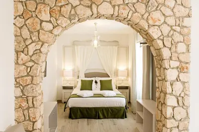 Cama o camas de una habitación en Suites La Posada De Pilar