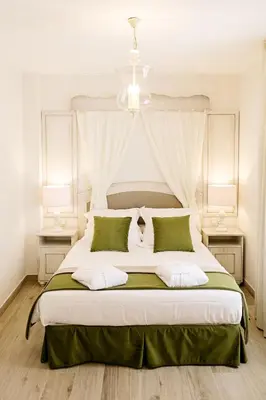 Cama o camas de una habitación en Suites La Posada De Pilar