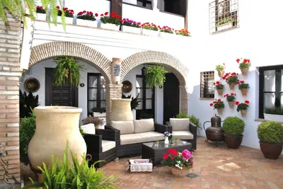 Zona de estar de Suites La Posada De Pilar