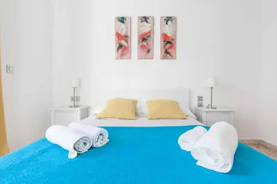 Cama o camas de una habitación en Maravilloso dúplex en Sevilla Escoberos
