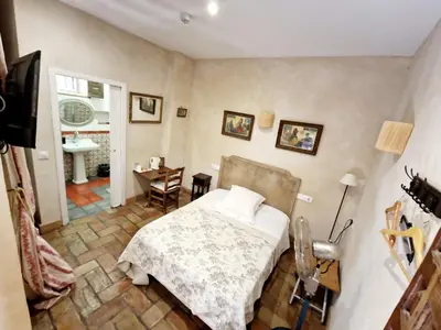 Cama o camas de una habitación en Hostal Casa Del Buen Viaje