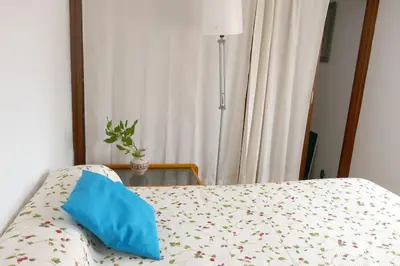 Cama o camas de una habitación en Casa Soleada Calle Tranquila Junto a FIBES