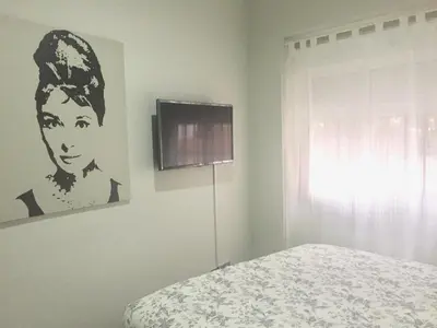 Una televisión o centro de entretenimiento en Apartamento doña María Coronel Sevilla