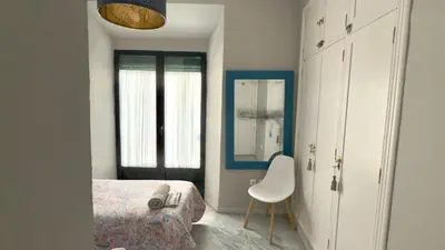 Cama o camas de una habitación en Casa San Martín Sevilla