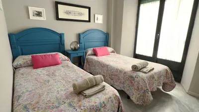 Cama o camas de una habitación en Casa San Martín Sevilla