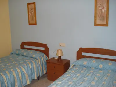Cama o camas de una habitación en Pensión Bienvenido