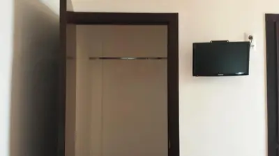 Una televisión o centro de entretenimiento en Pension Gran Plaza