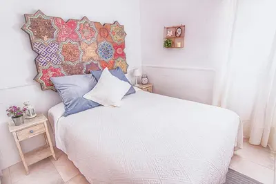 Cama o camas de una habitación en Mercado Calle Feria
