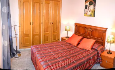 Cama o camas de una habitación en Apartamentos Sevilla