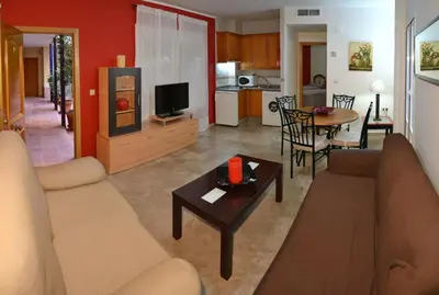 Una televisión o centro de entretenimiento en Apartamentos Sevilla