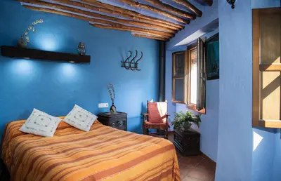 Cama o camas de una habitación en Casilla Dalea en Carcabuey, descubre el interior de Andalucia