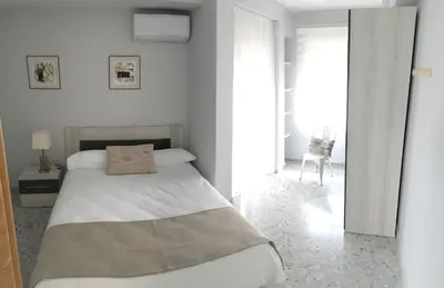 Cama o camas de una habitación en Piso La Compañía