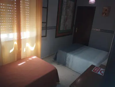 Cama o camas de una habitación en Hospedería Lucano