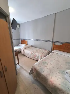 Cama o camas de una habitación en Hospedería Lucano