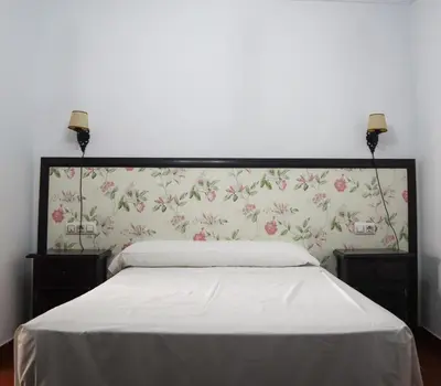 Cama o camas de una habitación en Apartamentos Turisticos Casa Cantillo