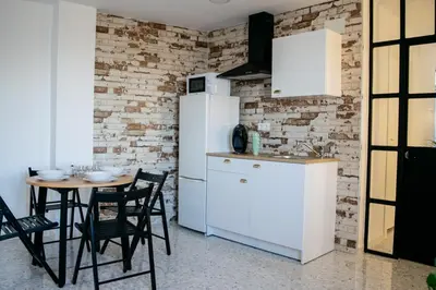 Una cocina o zona de cocina en Alojamientos Teatro