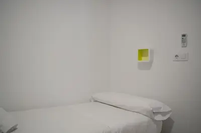 Cama o camas de una habitación en Alojamientos Teatro