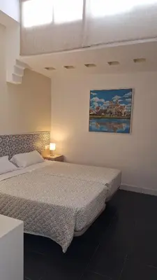 Cama o camas de una habitación en Hostal San Vicente II