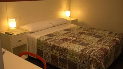 Cama o camas de una habitación en Hostal San Vicente II