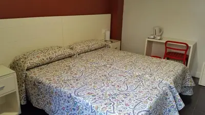 Cama o camas de una habitación en Hostal San Vicente II