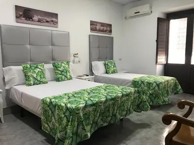 Cama o camas de una habitación en La Casa en el Centro