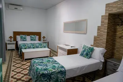 Cama o camas de una habitación en La Casa en el Centro