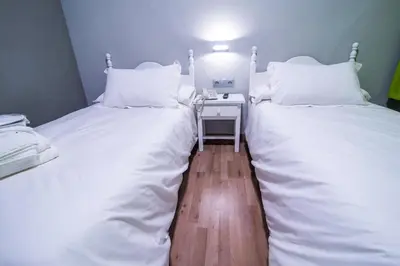 Cama o camas de una habitación en Hotel Nomada