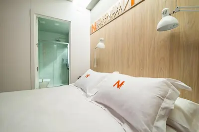 Cama o camas de una habitación en Hotel Nomada
