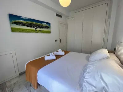 Cama o camas de una habitación en Ático San Bernardo Terraza y Parking Incluido