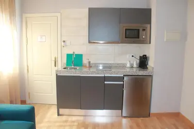 Una cocina o zona de cocina en Hotel Torre del Oro