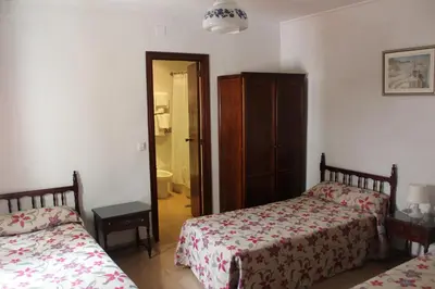 Cama o camas de una habitación en Hostal Santa Ana