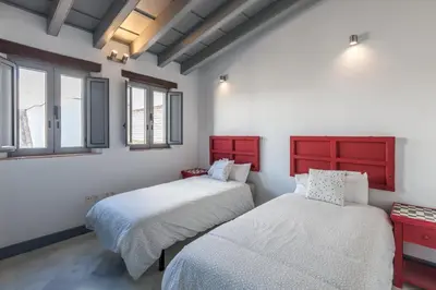 Cama o camas de una habitación en Casas de Sevilla - Apartamentos Tintes12
