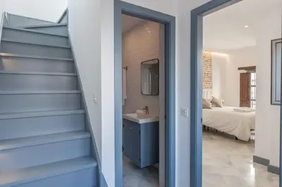 Cama o camas de una habitación en Casas de Sevilla - Apartamentos Tintes12