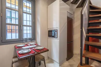 Una cocina o zona de cocina en Casas de Sevilla - Apartamentos Tintes12