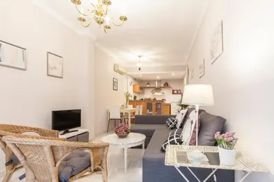 Una televisión o centro de entretenimiento en Elegante apartamento en el corazon de Sevilla.