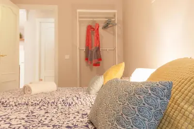 Cama o camas de una habitación en Elegante apartamento en el corazon de Sevilla.
