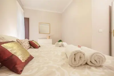 Cama o camas de una habitación en Elegante apartamento en el corazon de Sevilla.
