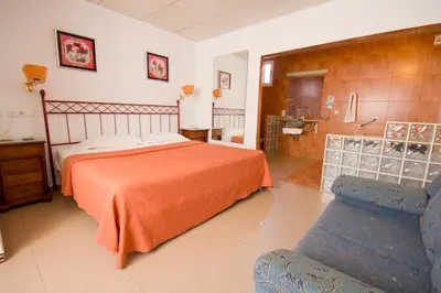 Cama o camas de una habitación en Hostal Nueva Andalucia