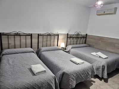 Cama o camas de una habitación en Pensión Javier