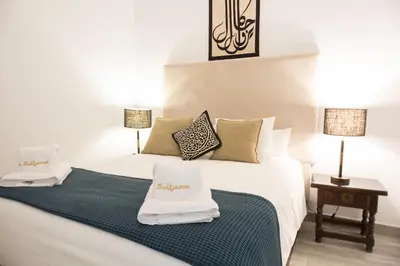 Cama o camas de una habitación en La Sultana Apartamentos