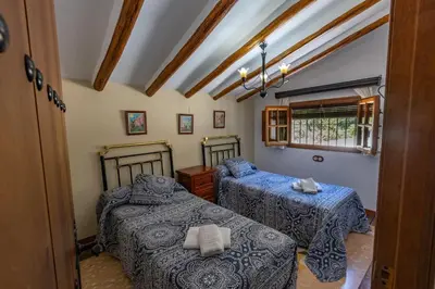 Cama o camas de una habitación en El Rincon de Carmen