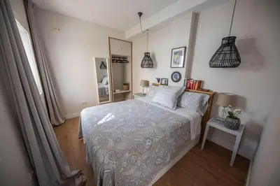Cama o camas de una habitación en Cosy Apartment with Terrace in the Centre of Seville