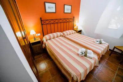 Cama o camas de una habitación en Casa Rural San Antonio