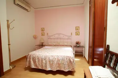 Cama o camas de una habitación en Hostal Jiménez
